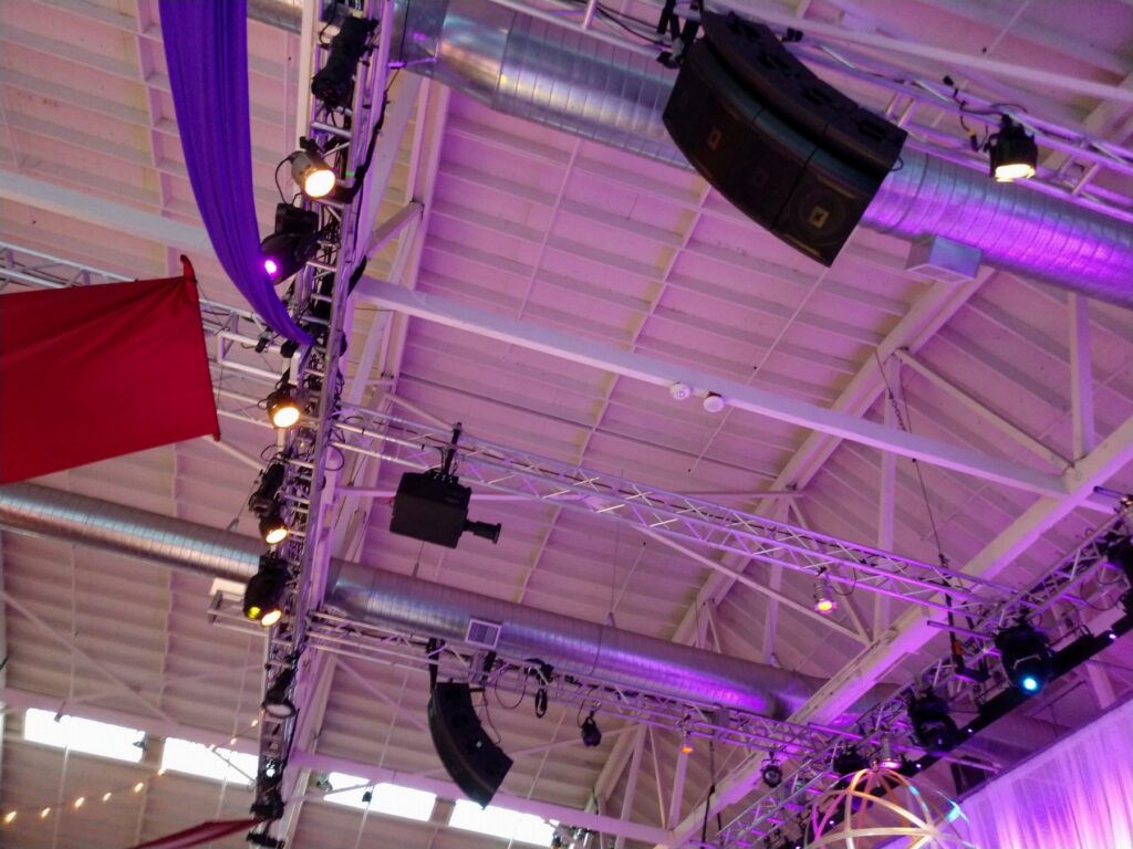 Flown line arrays and lighting on overhead truss