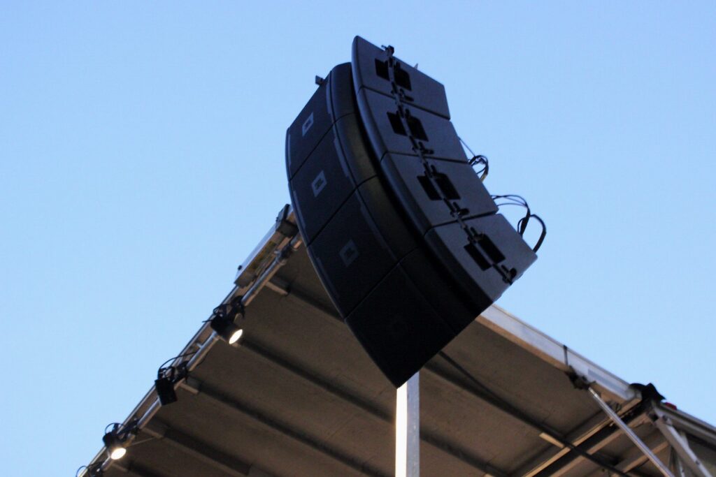 Line array hung from an outdoor stage roof