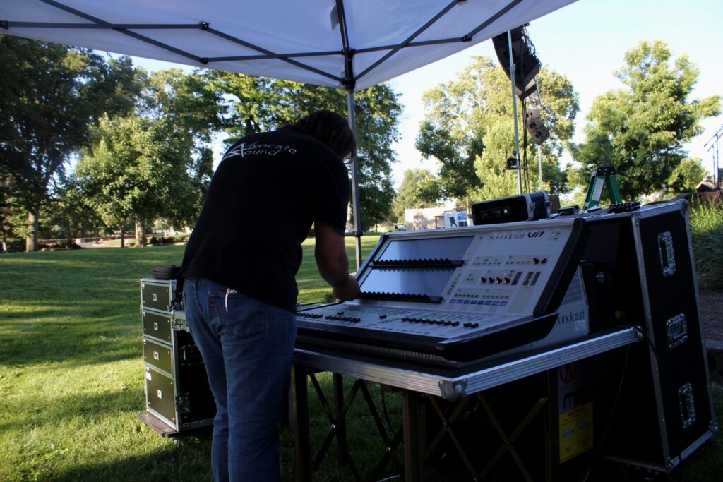 Setting up a digital console for an outdoor park show